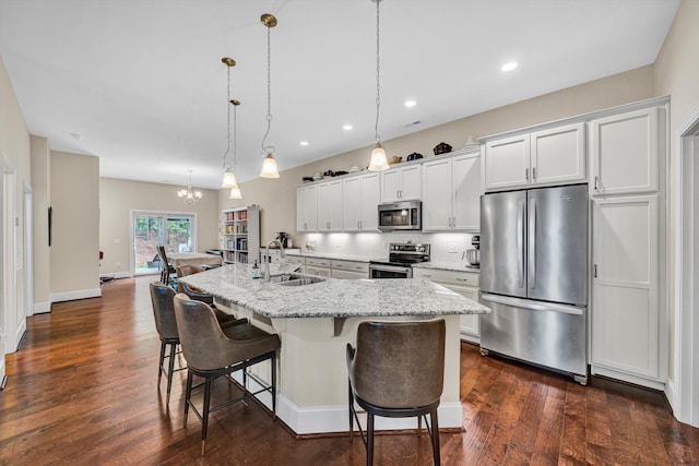 4742 Leigh Ln, Roanoke, VA 24018 - kitchen featuring appliances with stainless steel finishes, a sink, a center island with sink, a chandelier, and a kitchen bar