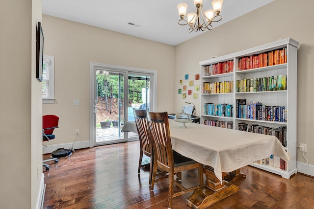 4742 Leigh Ln, Roanoke, VA 24018 - dining room featuring a chandelier, wood finished floors, and baseboards