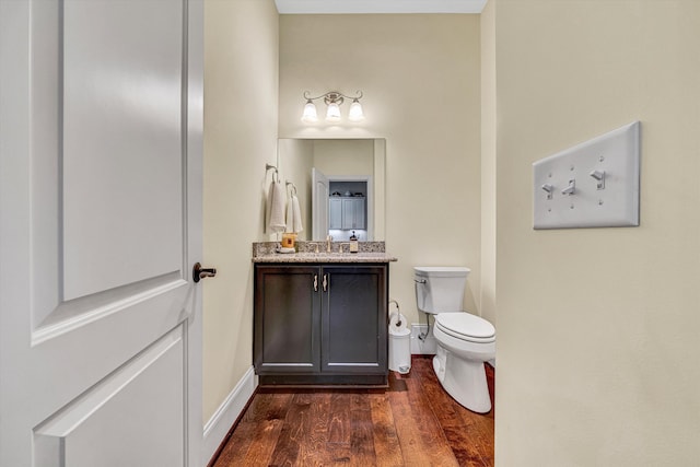 4742 Leigh Ln, Roanoke, VA 24018 - bathroom featuring wood finished floors, toilet, vanity, and baseboards