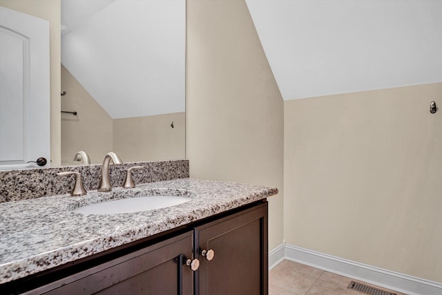 4742 Leigh Ln, Roanoke, VA 24018 - bathroom featuring vaulted ceiling, vanity, baseboards, and tile patterned flooring