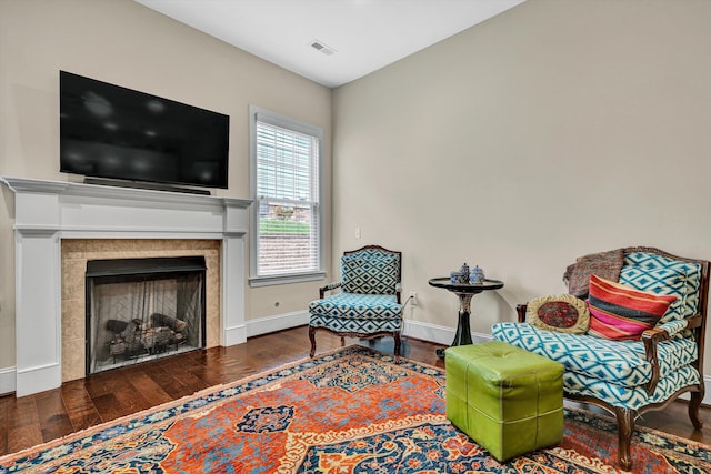 4742 Leigh Ln, Roanoke, VA 24018 - sitting room with wood finished floors, baseboards, and a fireplace