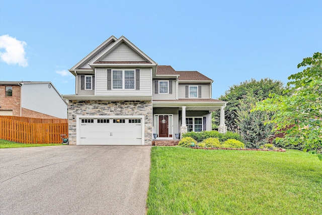 1407 Brandon Ave SW, Roanoke, VA 24015 - craftsman inspired home featuring asphalt driveway, stone siding, a garage, and covered porch