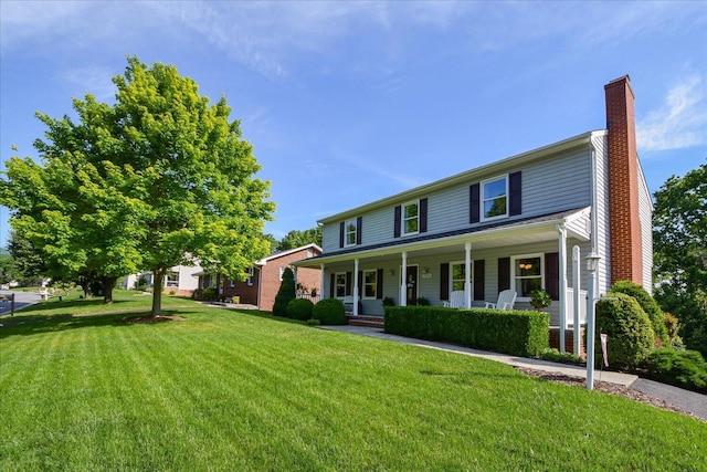 7268 Twin Forks Dr, Roanoke, VA 24019 - view of front of property with a chimney, a porch, and a front yard