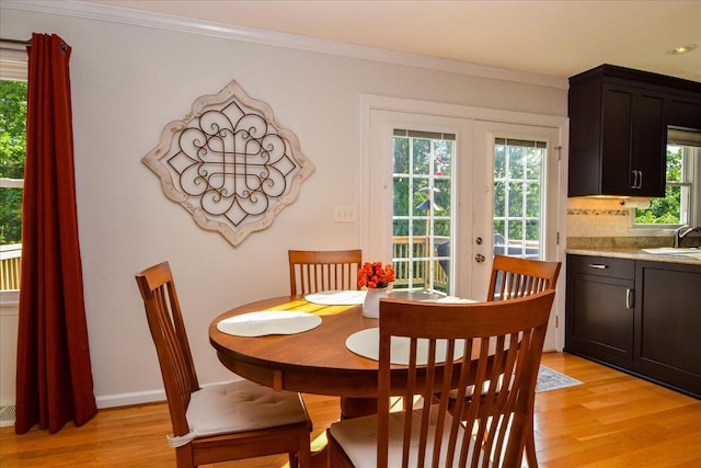 7268 Twin Forks Dr, Roanoke, VA 24019 - dining space featuring light wood-style flooring, french doors, ornamental molding, baseboards, and recessed lighting