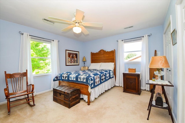 7268 Twin Forks Dr, Roanoke, VA 24019 - bedroom with light colored carpet, multiple windows, baseboards, and ceiling fan