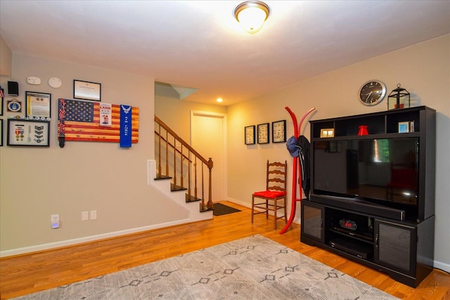 7268 Twin Forks Dr, Roanoke, VA 24019 - living room with wood finished floors, stairs, and baseboards