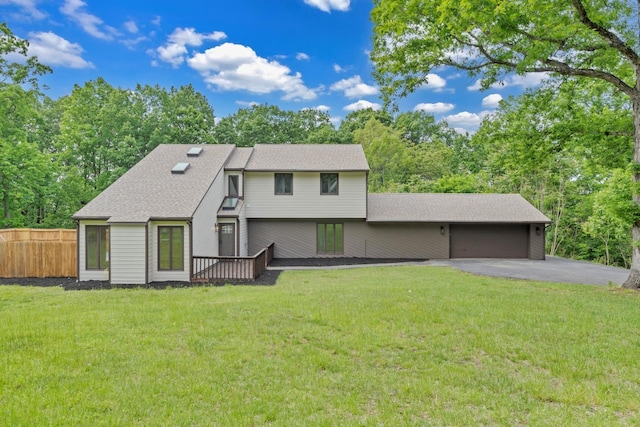 6695 Raintree Rd, Roanoke, VA 24018 - view of front facade featuring a garage, driveway, and a shingled roof