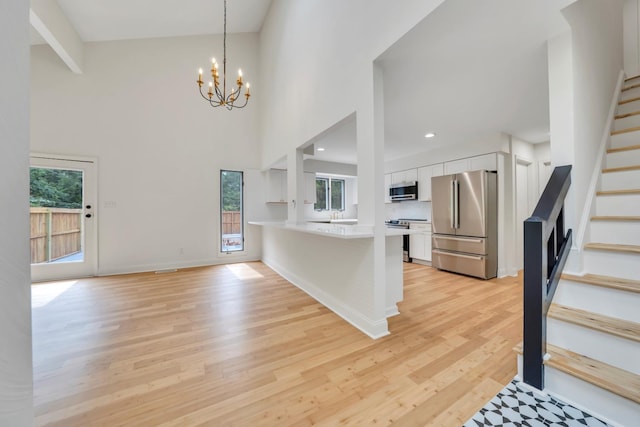 6695 Raintree Rd, Roanoke, VA 24018 - foyer with stairs, healthy amount of natural light, light wood-style flooring, recessed lighting, and a high ceiling