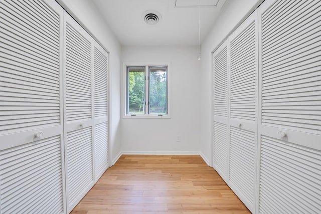 6695 Raintree Rd, Roanoke, VA 24018 - unfurnished bedroom featuring light wood-type flooring, baseboards, and attic access