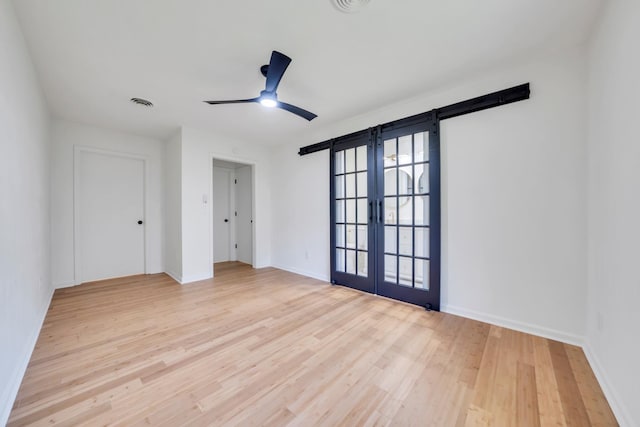 6695 Raintree Rd, Roanoke, VA 24018 - spare room featuring french doors, wood finished floors, ceiling fan, and baseboards