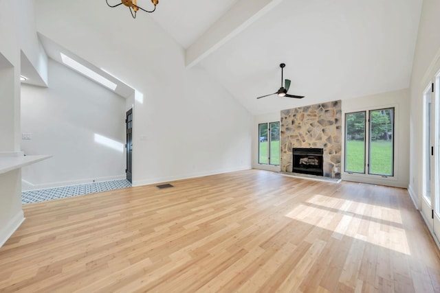 6695 Raintree Rd, Roanoke, VA 24018 - unfurnished living room featuring high vaulted ceiling, a ceiling fan, light wood finished floors, beamed ceiling, and a fireplace