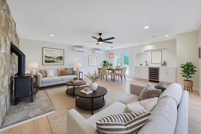 6695 Raintree Rd, Roanoke, VA 24018 - living area featuring beverage cooler, an AC wall unit, ceiling fan, light wood finished floors, and recessed lighting