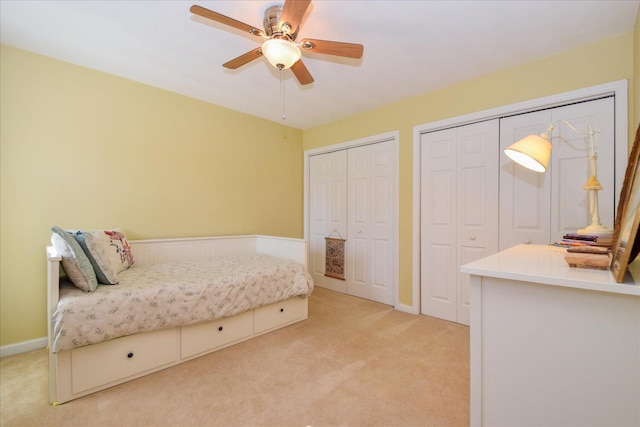7635 Peebles Ln, Roanoke, VA 24018 - bedroom with light carpet, multiple closets, and ceiling fan