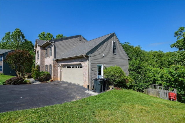 7635 Peebles Ln, Roanoke, VA 24018 - view of home's exterior featuring asphalt driveway, brick siding, and an attached garage