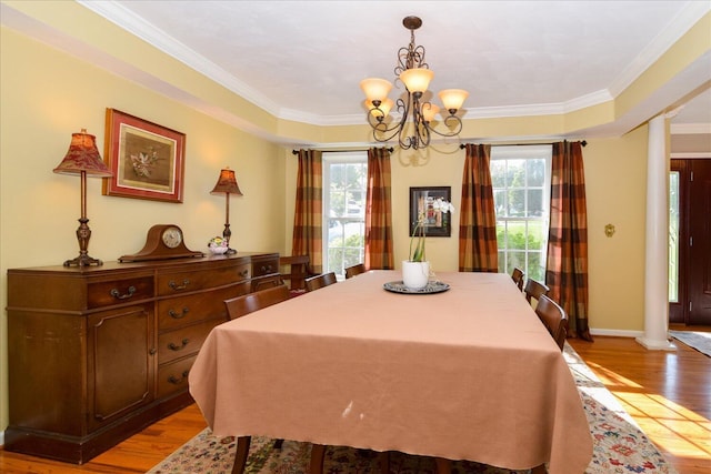7635 Peebles Ln, Roanoke, VA 24018 - dining space with a chandelier, light wood-style flooring, crown molding, and baseboards