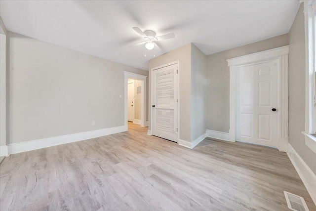1120 6th St SE, Roanoke, VA 24013 - unfurnished bedroom featuring baseboards, wood finished floors, a closet, and ceiling fan