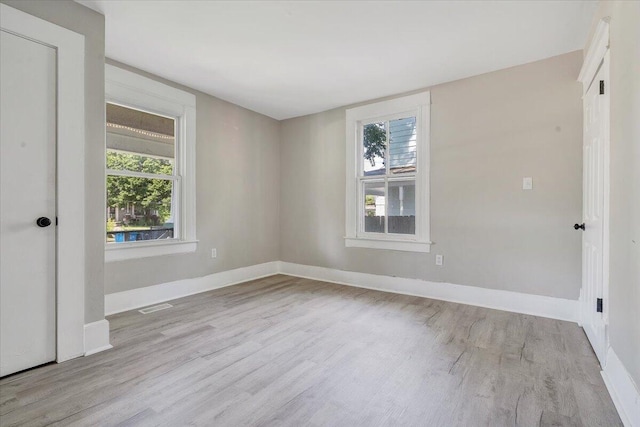 1120 6th St SE, Roanoke, VA 24013 - empty room featuring wood finished floors and baseboards