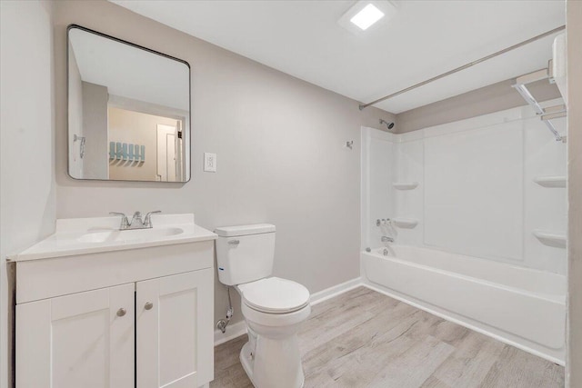 1120 6th St SE, Roanoke, VA 24013 - bathroom featuring wood finished floors, vanity, toilet, shower / tub combination, and baseboards
