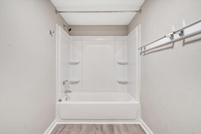1120 6th St SE, Roanoke, VA 24013 - full bath with wood finished floors, baseboards, and bathing tub / shower combination