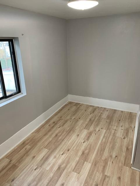 1120 6th St SE, Roanoke, VA 24013 - empty room featuring light wood-type flooring and baseboards