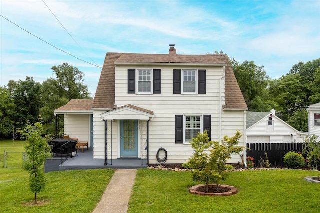 5038 Morwanda St NW, Roanoke, VA 24017 - view of front facade with a chimney, a shingled roof, and a patio area
