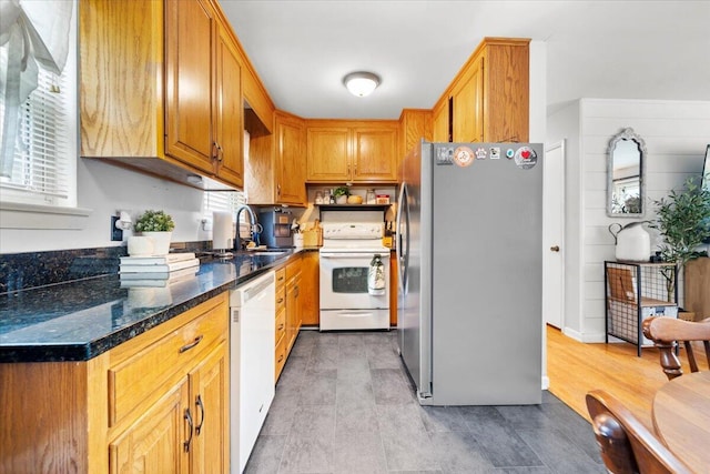 2136 Bainbridge Dr, Salem, VA 24153 - kitchen featuring white appliances, a sink, healthy amount of natural light, and dark stone counters