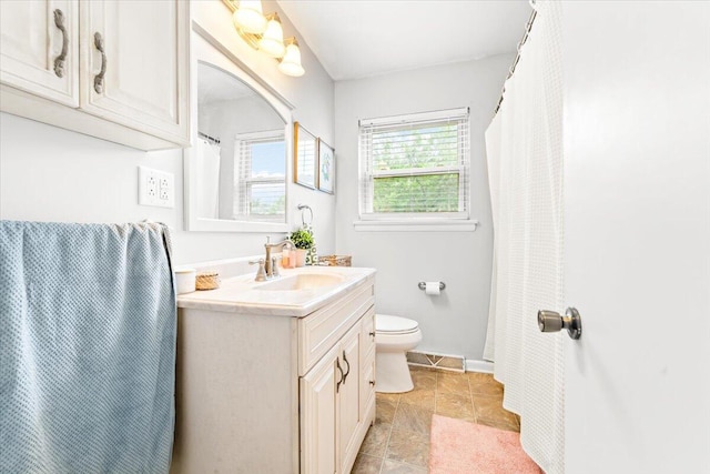 2136 Bainbridge Dr, Salem, VA 24153 - full bath with toilet, vanity, and baseboards