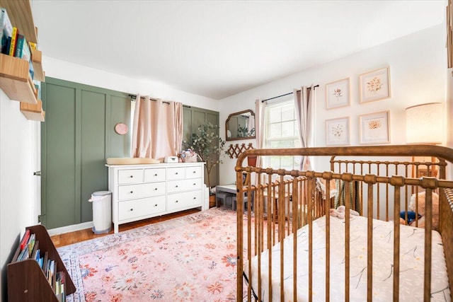 2136 Bainbridge Dr, Salem, VA 24153 - bedroom with wood finished floors and a crib