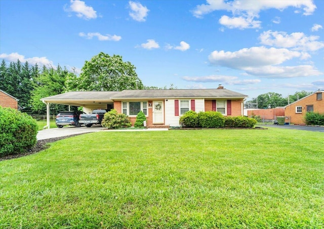 2136 Bainbridge Dr, Salem, VA 24153 - ranch-style house with a carport, a front yard, driveway, brick siding, and a chimney