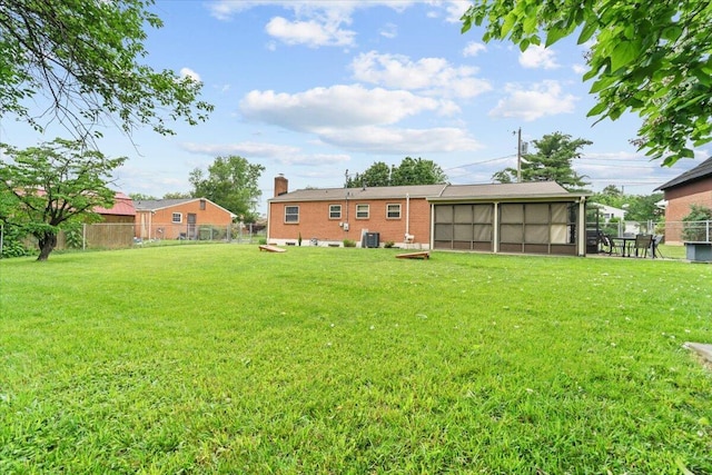 2136 Bainbridge Dr, Salem, VA 24153 - back of house featuring a sunroom, brick siding, a chimney, and central air condition unit