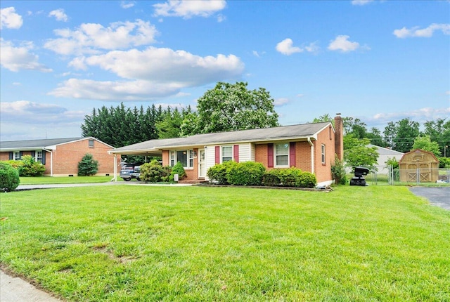 2136 Bainbridge Dr, Salem, VA 24153 - single story home with a chimney, a carport, brick siding, an outdoor structure, and driveway