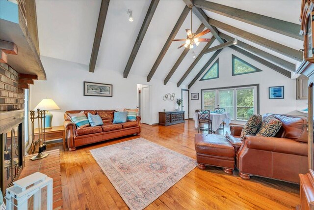 48 Overlook Rd, Hardy, VA 24101 - living area with a brick fireplace, high vaulted ceiling, beam ceiling, light wood-style floors, and a ceiling fan