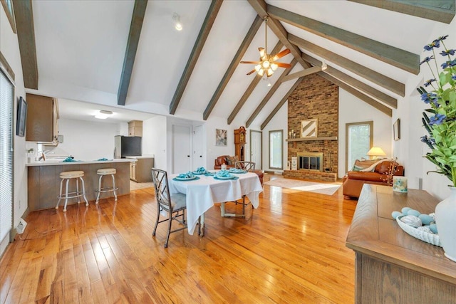 48 Overlook Rd, Hardy, VA 24101 - dining room with light wood-style flooring, beamed ceiling, a brick fireplace, ceiling fan, and high vaulted ceiling