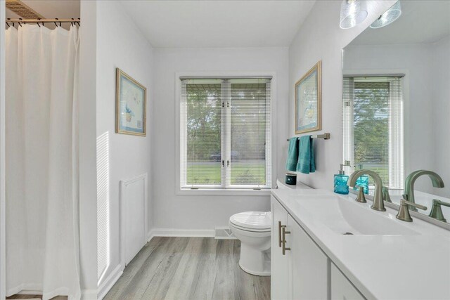48 Overlook Rd, Hardy, VA 24101 - full bathroom featuring toilet, wood finished floors, plenty of natural light, and baseboards