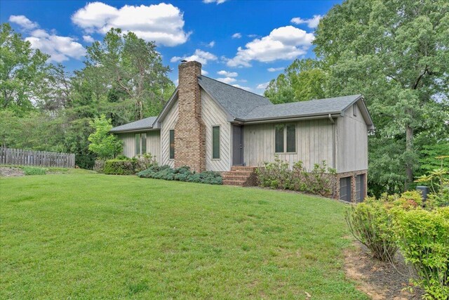 48 Overlook Rd, Hardy, VA 24101 - view of side of home featuring an attached garage, a chimney, and roof with shingles