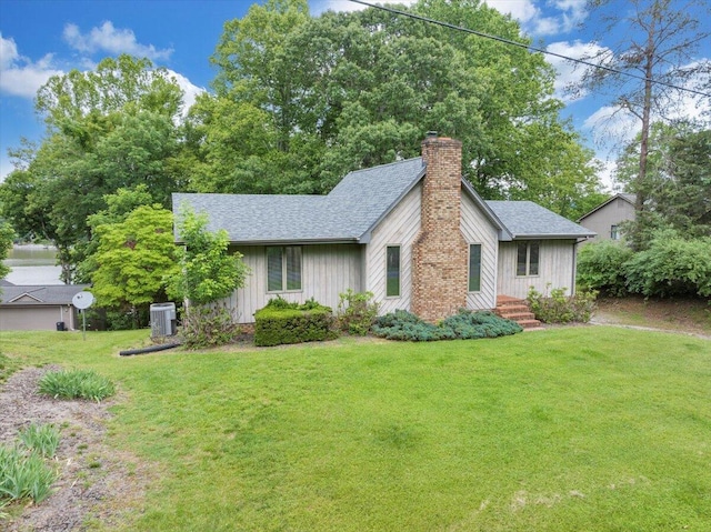 48 Overlook Rd, Hardy, VA 24101 - view of front of house featuring a chimney, roof with shingles, a front lawn, cooling unit, and board and batten siding