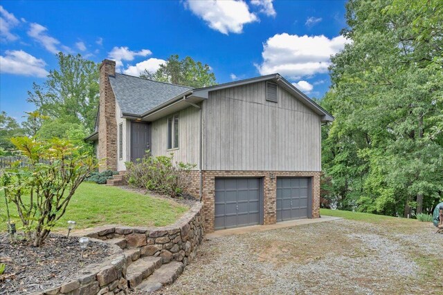 48 Overlook Rd, Hardy, VA 24101 - view of side of home featuring dirt driveway, a garage, a chimney, roof with shingles, and a yard