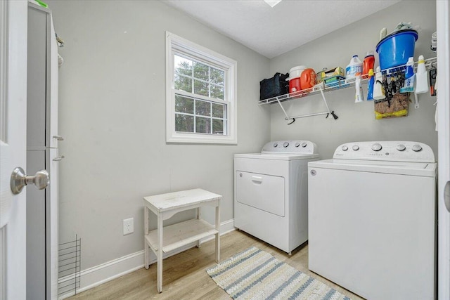 245 Indian Pointe Dr, Hardy, VA 24101 - washroom with washer and dryer, light wood-type flooring, and baseboards