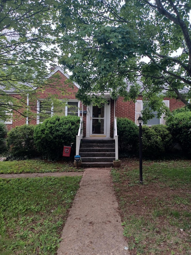 2521 Chatham St NW, Roanoke, VA 24012 - view of property hidden behind natural elements with brick siding and entry steps