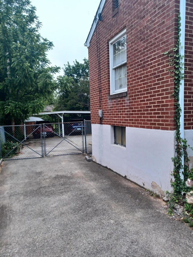 2521 Chatham St NW, Roanoke, VA 24012 - view of home's exterior featuring a gate and brick siding