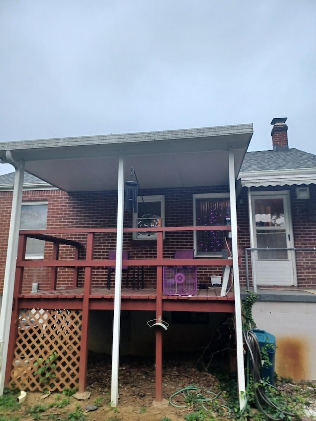 2521 Chatham St NW, Roanoke, VA 24012 - back of house featuring brick siding and a chimney