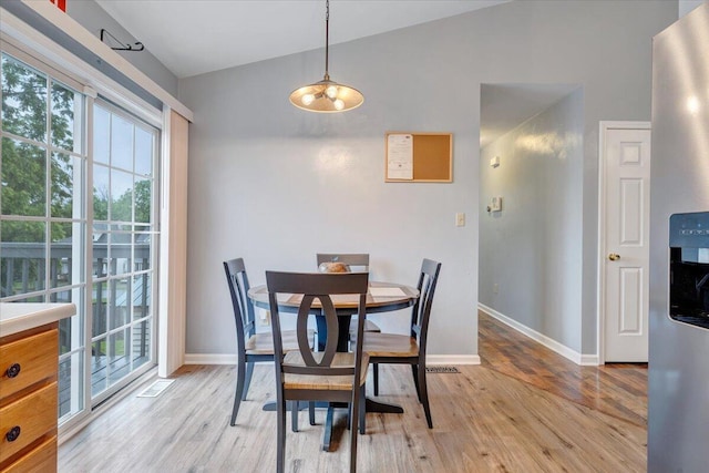 1152 Murray Ave SE, Roanoke, VA 24013 - dining room featuring healthy amount of natural light, light wood-style floors, baseboards, and lofted ceiling