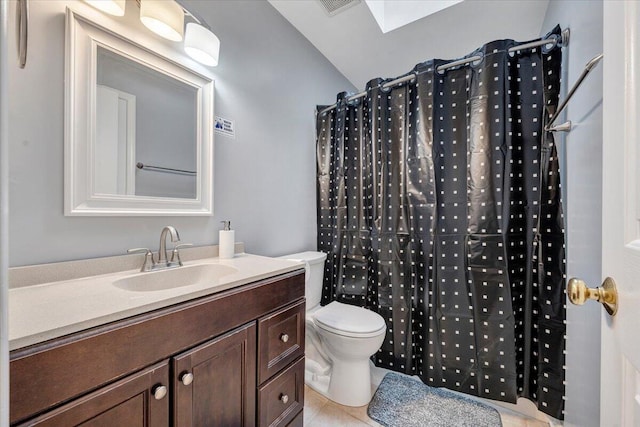 1152 Murray Ave SE, Roanoke, VA 24013 - bathroom featuring vanity, toilet, tile patterned flooring, a shower with shower curtain, and a skylight