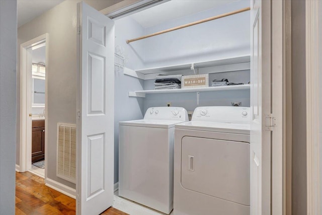 1152 Murray Ave SE, Roanoke, VA 24013 - washroom featuring washer and dryer and light wood-style floors