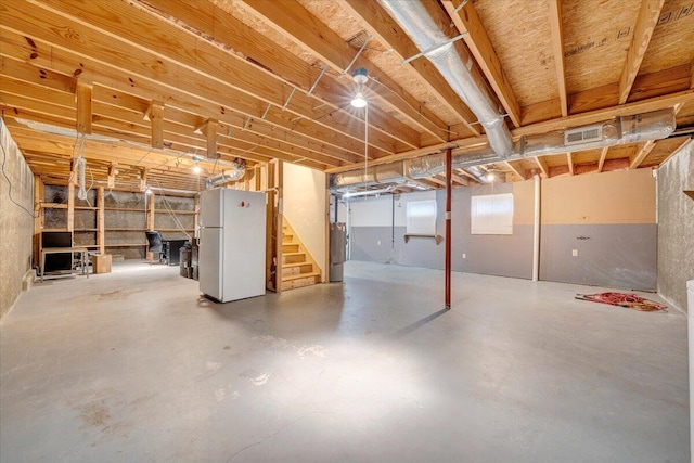 1152 Murray Ave SE, Roanoke, VA 24013 - below grade area featuring freestanding refrigerator and stairs