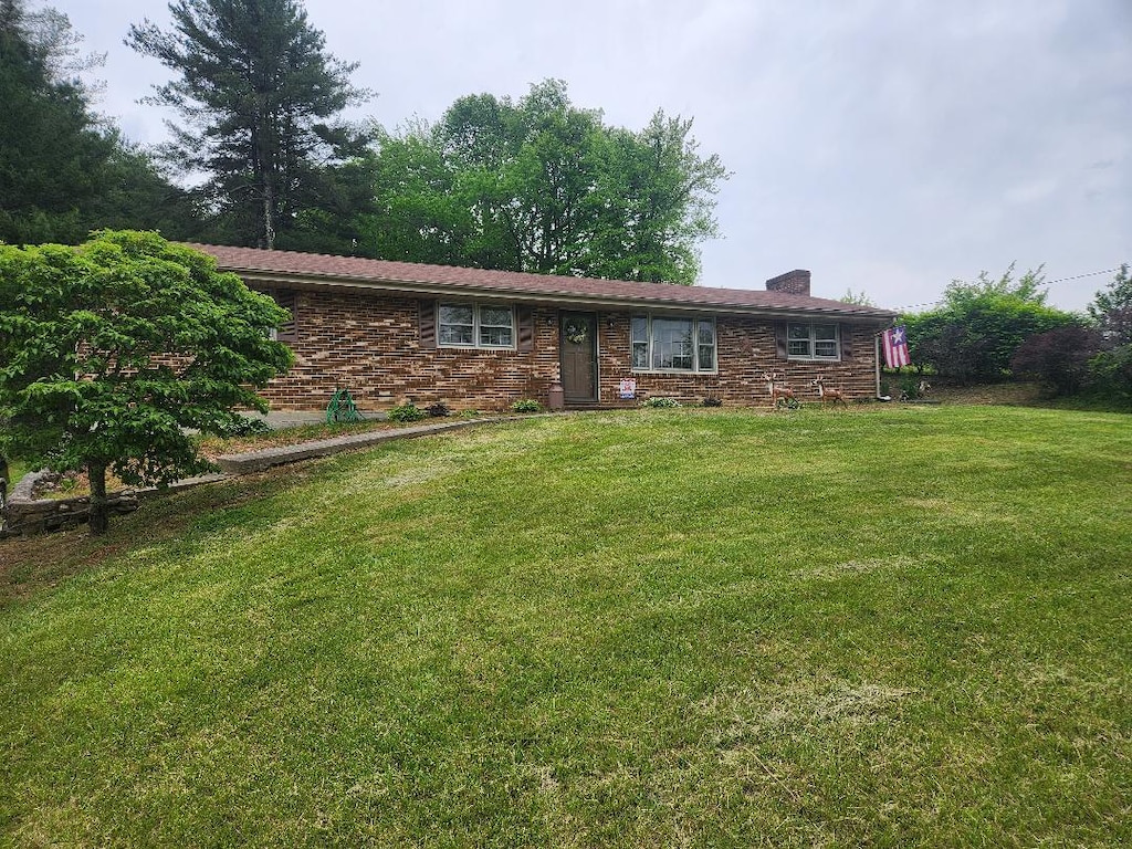 10496 Bent Mountain Rd, Bent Mountain, VA 24059 - view of front of property featuring a chimney, a front yard, and brick siding