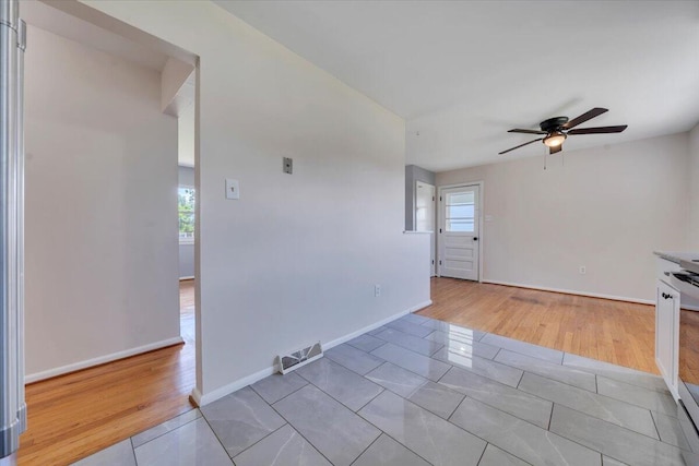 3734 Long Meadow Ave NW, Roanoke, VA 24017 - unfurnished room featuring a ceiling fan, baseboards, and light wood-type flooring