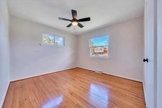 3734 Long Meadow Ave NW, Roanoke, VA 24017 - unfurnished room with wood finished floors, baseboards, and a ceiling fan