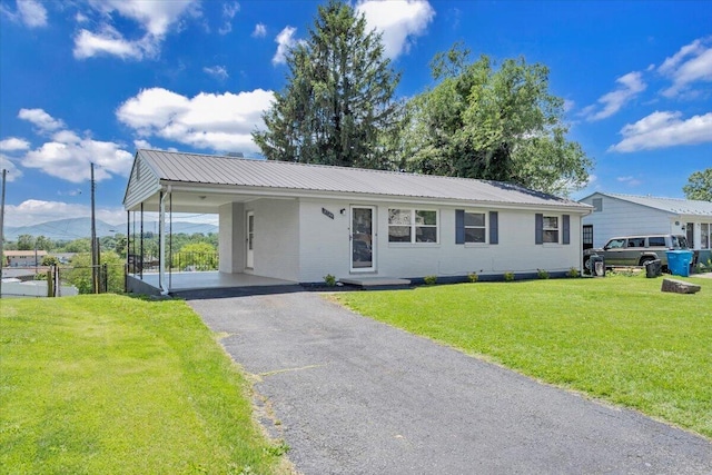 3734 Long Meadow Ave NW, Roanoke, VA 24017 - ranch-style home with metal roof, driveway, and an attached carport