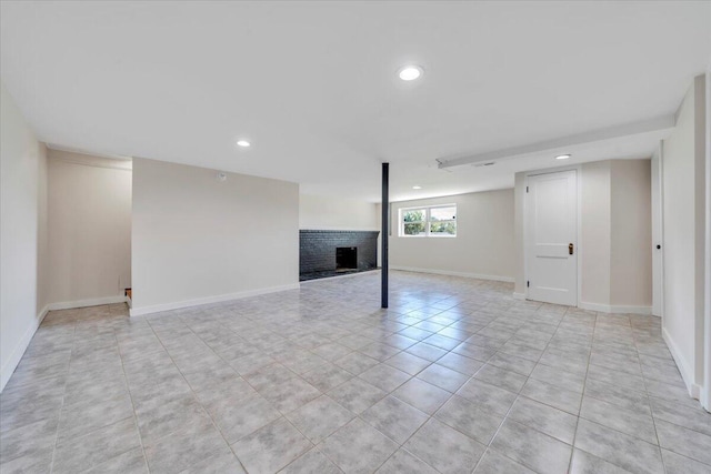 3734 Long Meadow Ave NW, Roanoke, VA 24017 - below grade area featuring a brick fireplace, recessed lighting, baseboards, and light tile patterned floors